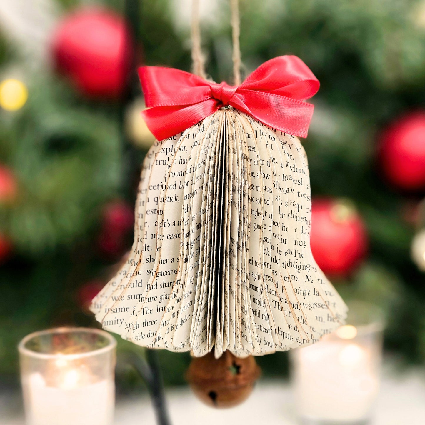 Bell shaped ornament made from book pages. Comes with a gift box, bow and gift tag.