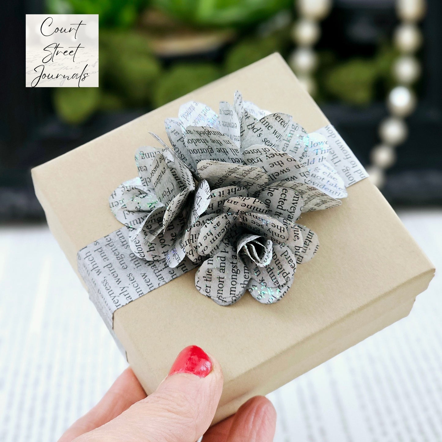 Jewelry Box, 3.5x3.5, adorned with 3 book page roses, handcrafted, the pages are gently stained black, slight sparkle on the end of the flowers