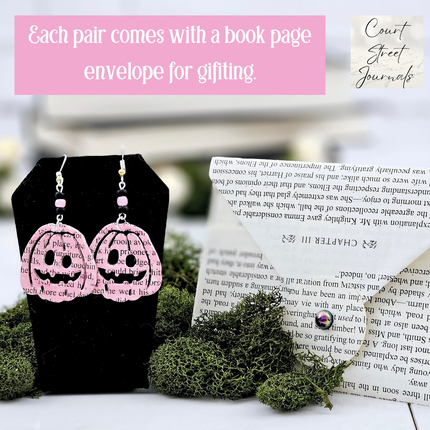 Pink Pumpking dangle earrings made with upcycled book pages. Ear wire choices are sterling silver or silver plated. Earrings come packaged in a hand made book page envelope.