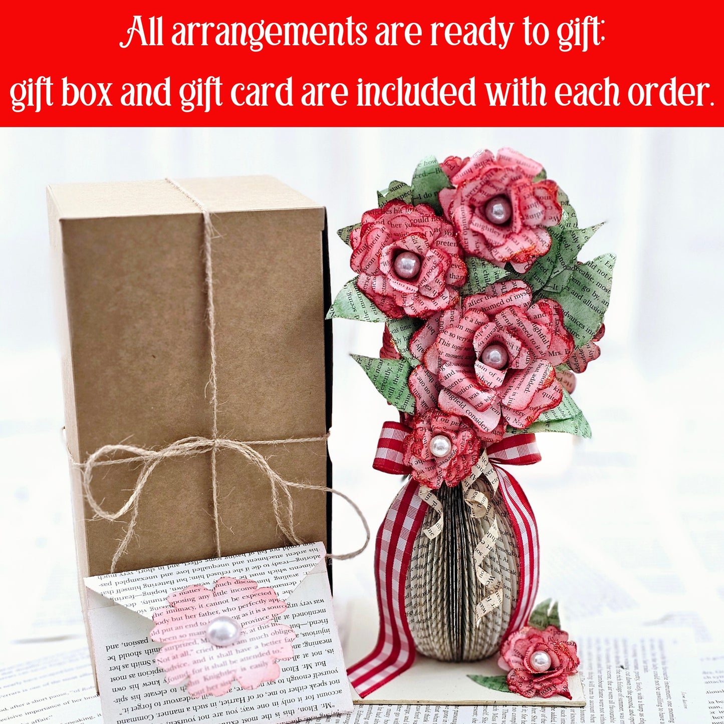 9 inch tall book page flower bouquet, the roses are stained red. The vase is made from book pages . The entire piece sits on a base made from the book cover.
