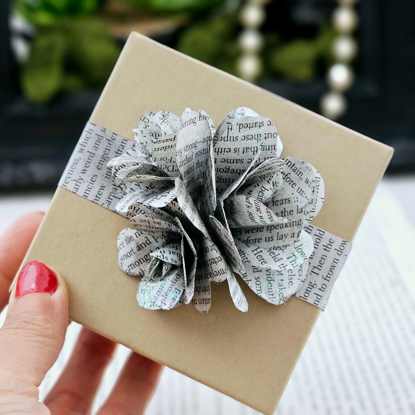 Jewelry Box, 3.5x3.5, adorned with 3 book page roses, handcrafted, the pages are gently stained black, slight sparkle on the end of the flowers