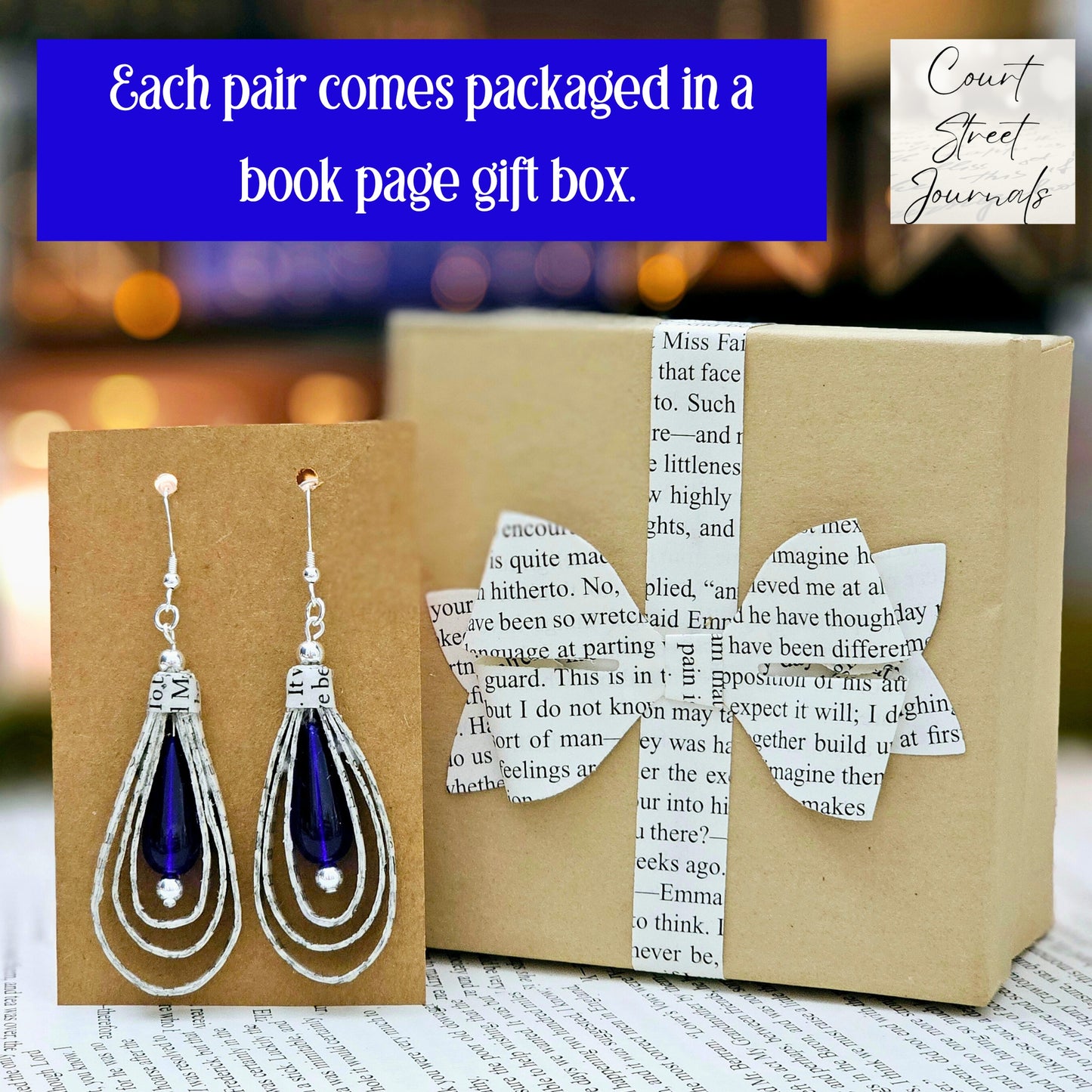 Tear Drop dangle earrings made from upcycled book pages with a blue czech glass tear drop bead accent. earring is 2.5 inches long. Sterling silver ear wire. Each pari comes in a gift box with a book page bow.