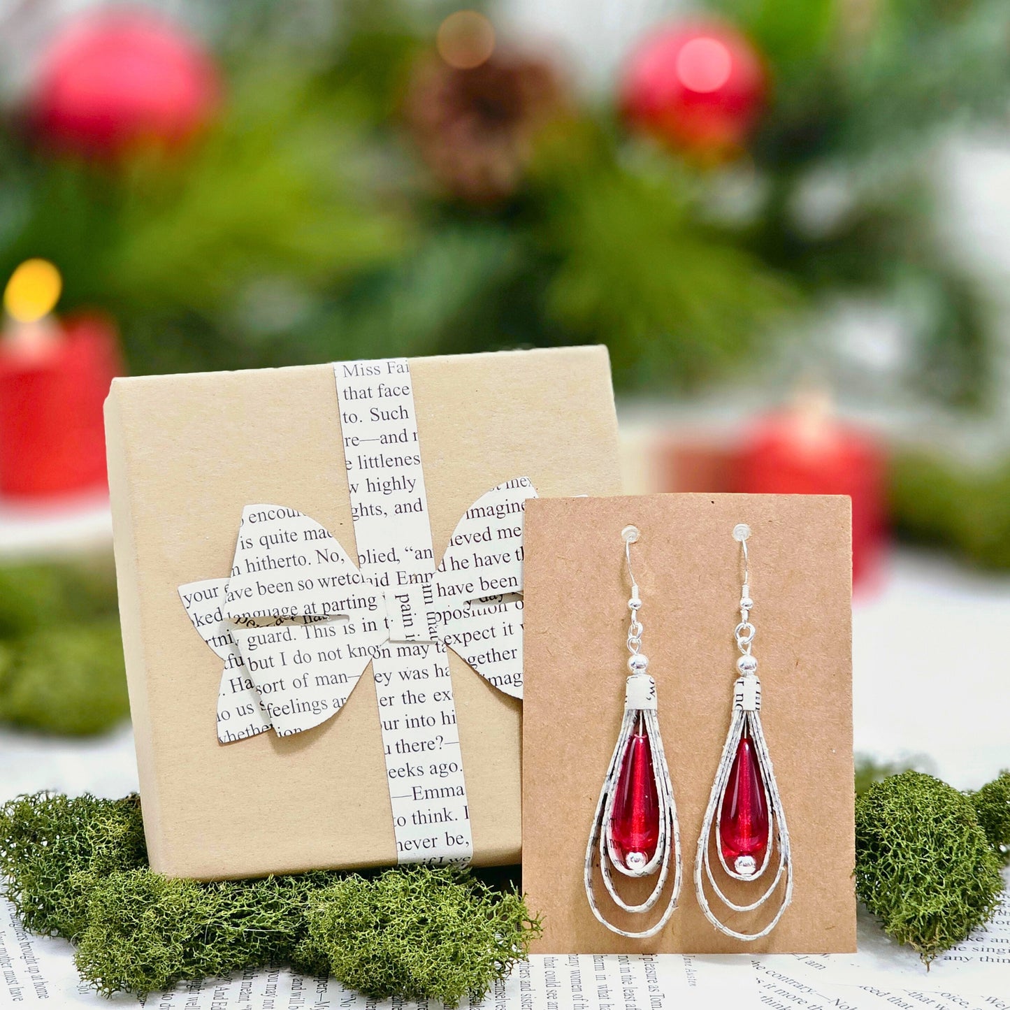 Handcrafted book lover earrings with red glass bead accent detail