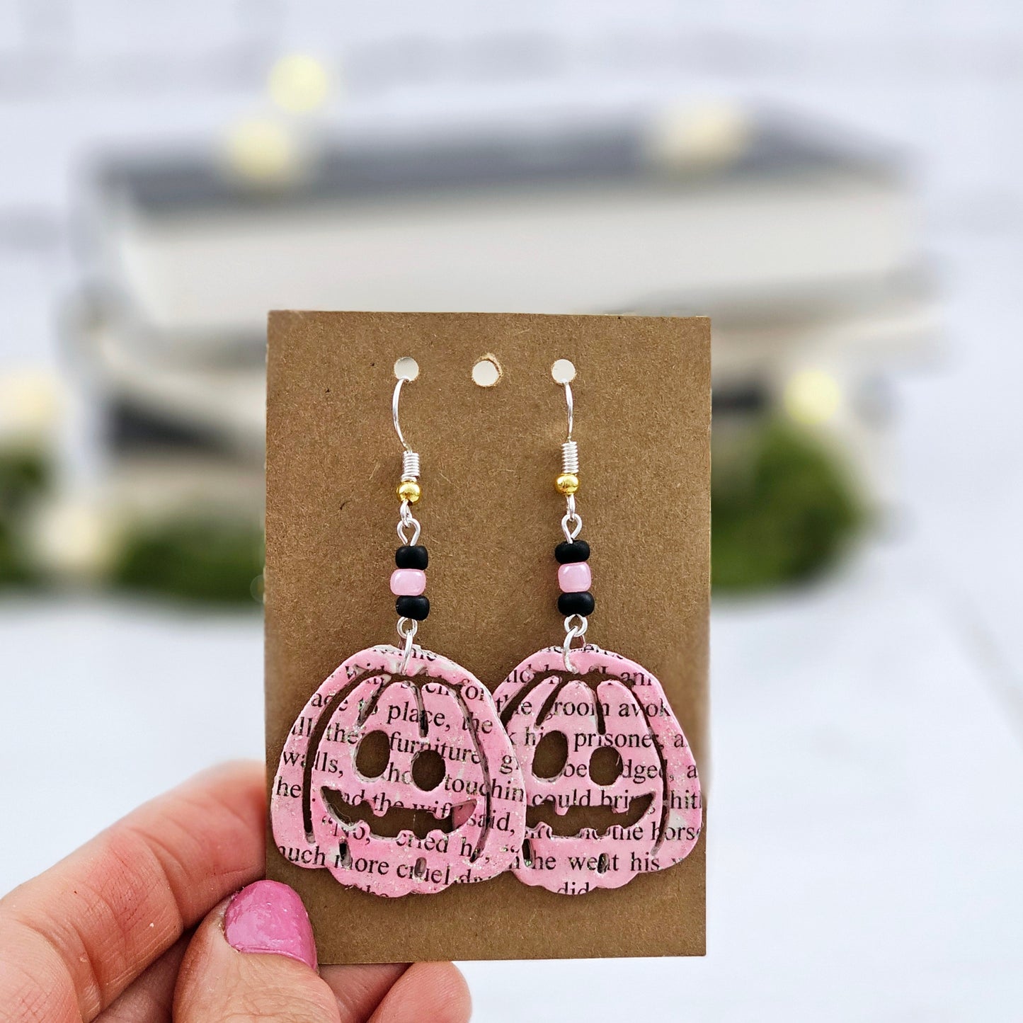 Pink Pumpking dangle earrings made with upcycled book pages. Ear wire choices are sterling silver or silver plated.
