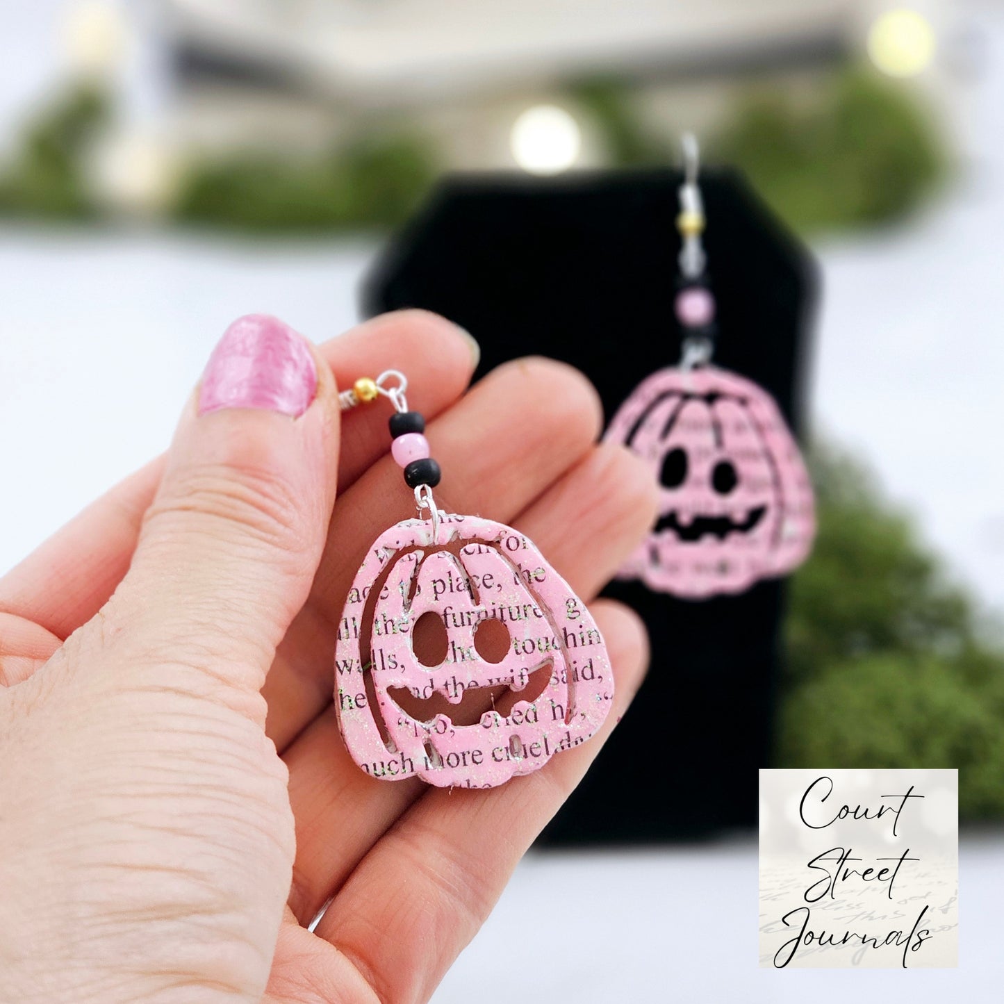 Pink Pumpking dangle earrings made with upcycled book pages. Ear wire choices are sterling silver or silver plated.