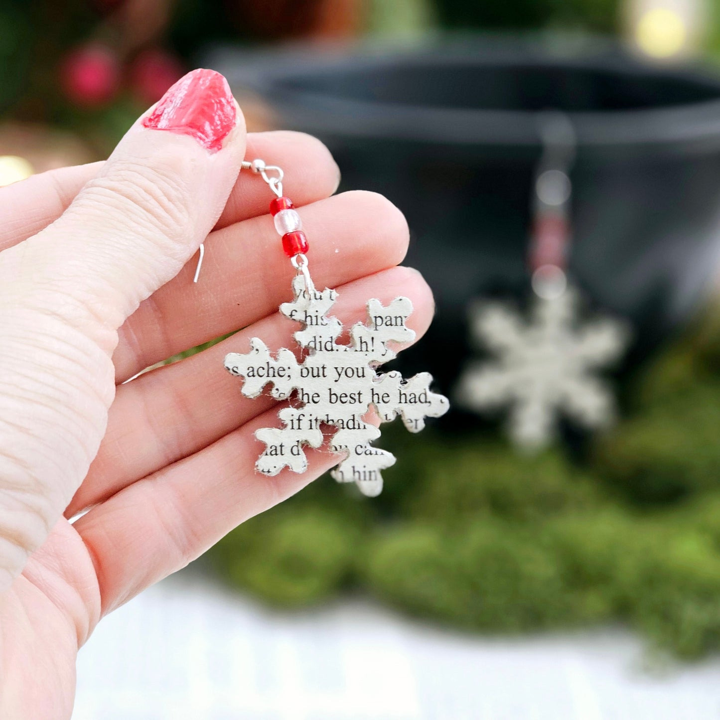 Snowflake Dangle Earrings made from upcycled book pages. Each earringhas 3 glass seed beads at the top. Sterling silver earwire.