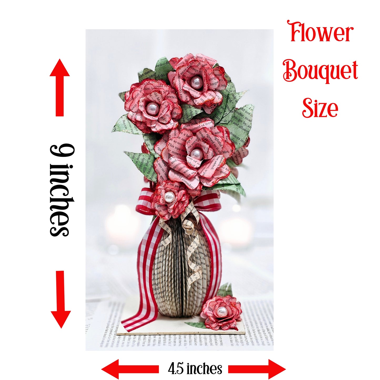 9 inch tall book page flower bouquet, the roses are stained red. The vase is made from book pages . The entire piece sits on a base made from the book cover.