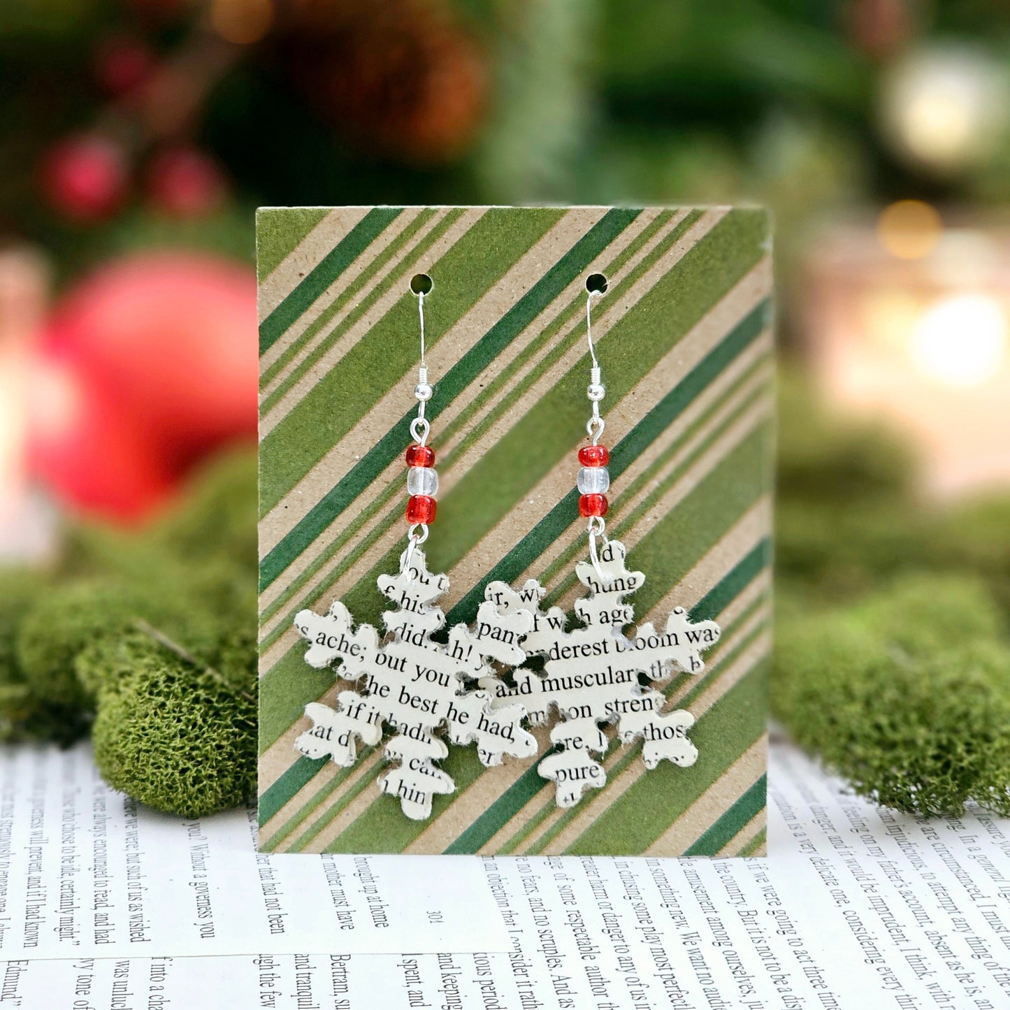 Snowflake Dangle Earrings made from upcycled book pages. Each earringhas 3 glass seed beads at the top. Sterling silver earwire.