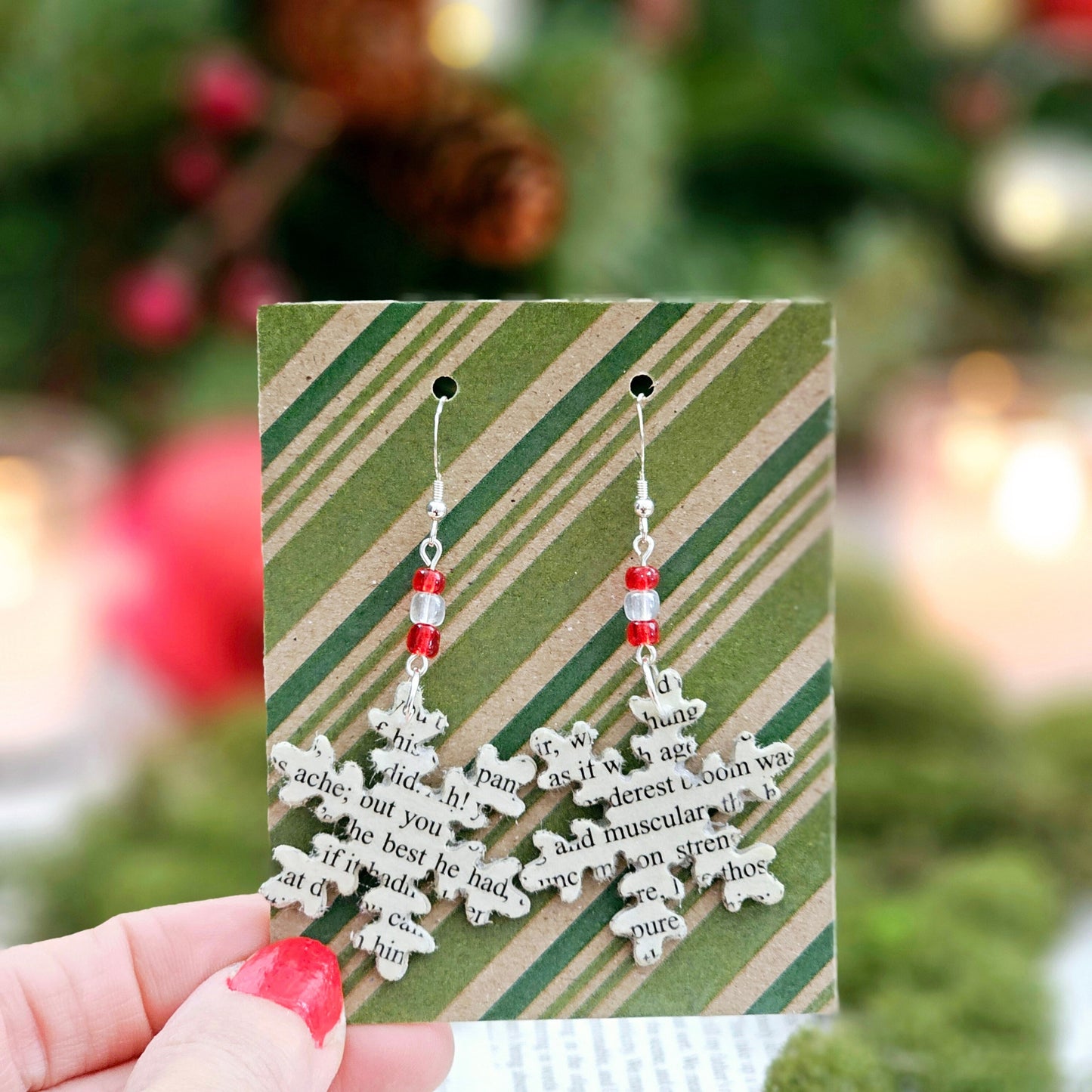 Snowflake Dangle Earrings made from upcycled book pages. Each earringhas 3 glass seed beads at the top. Sterling silver earwire.