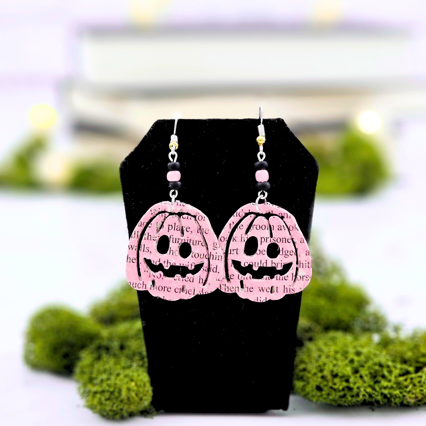 Pink Pumpking dangle earrings made with upcycled book pages. Ear wire choices are sterling silver or silver plated.
