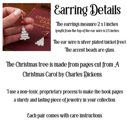 The earrings measure 2 inches long x 1 inches wide.  The ear wire is silver plated (nickel free).  The accent beads are glass. The tree is cut from the pages of A Chrismtas Carol.