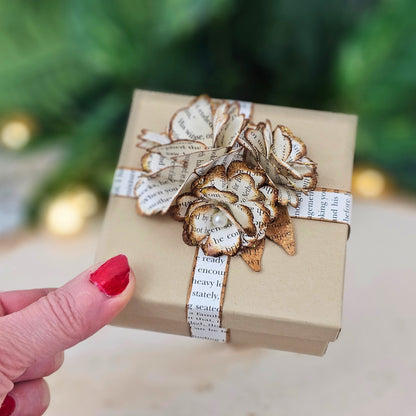 3 vintage style roses on each box with a pearl center