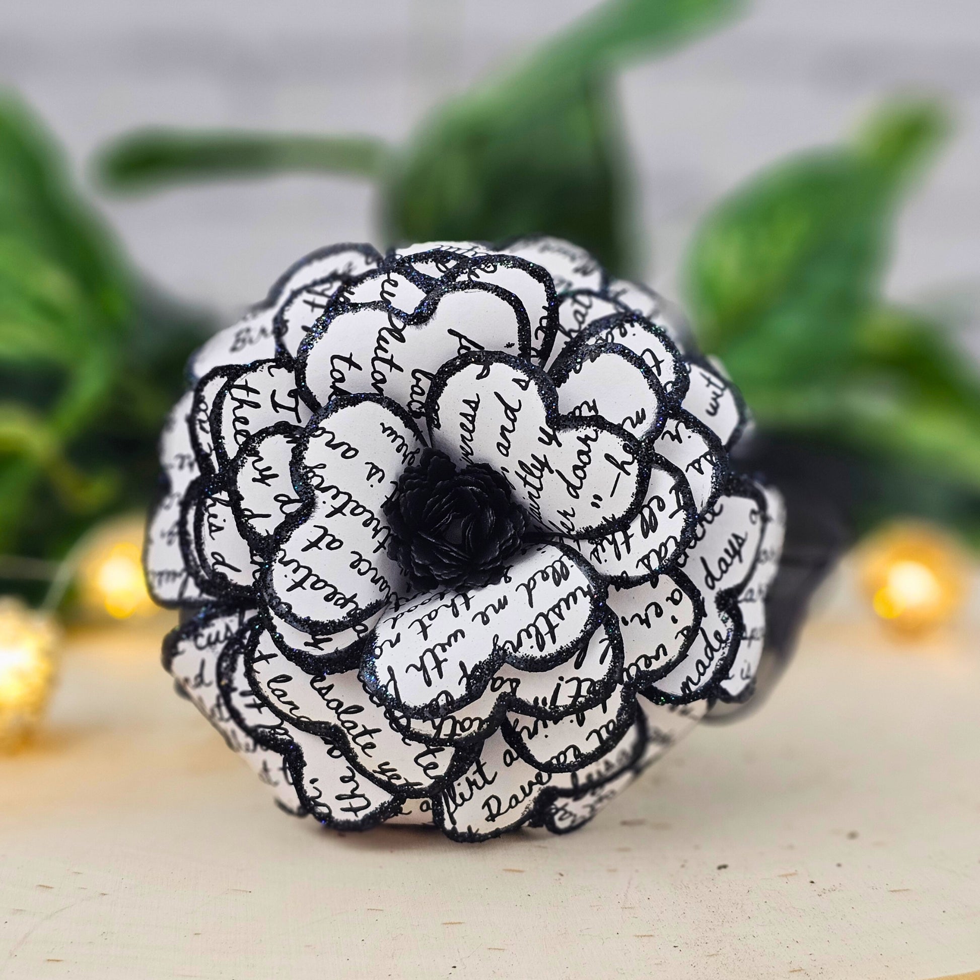 Close-up of gothic paper rose made from Edgar Allan Poe The Raven text