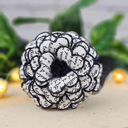 Close-up of gothic paper rose made from Edgar Allan Poe The Raven text