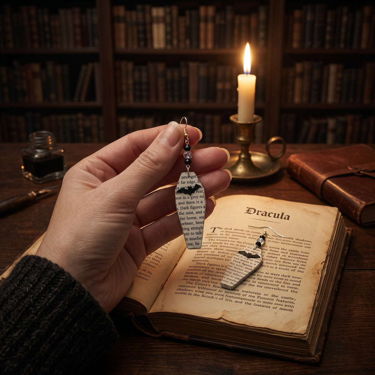 book page earrings made from dracula