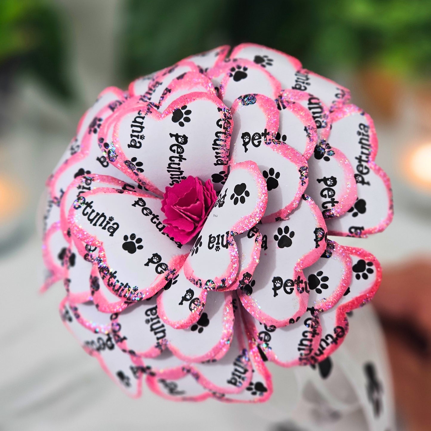 Close-up of pink memorial rose petals with paw print organza ribbon accent