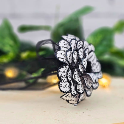 Side view of gothic paper rose made from the raven by edgar allan poe