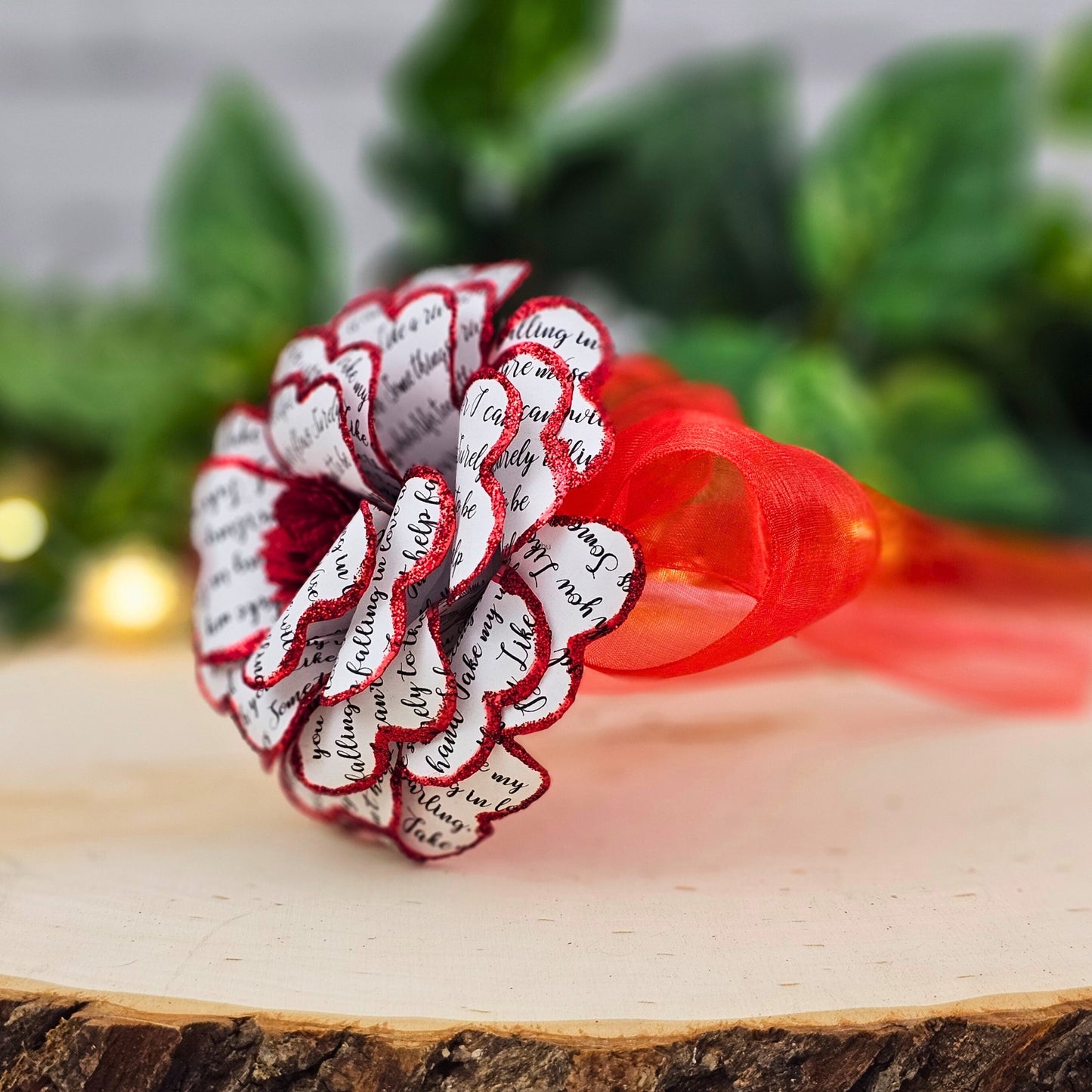 Side view of handmade song lyric rose showing stem and petal detail