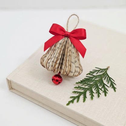 tiny book page bell christmas ornament made from upcycled book pages 