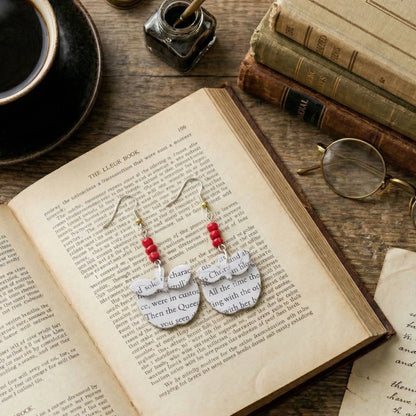 flat lay picture of apple book page earrings
