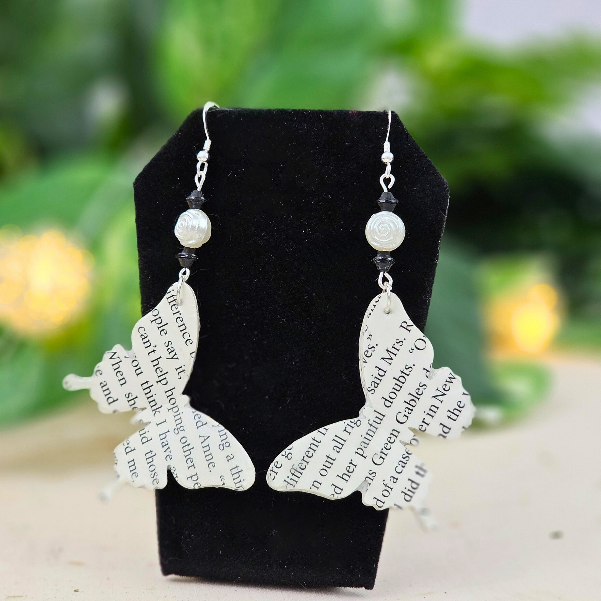 Handmade butterfly book page earrings with glass bead accent