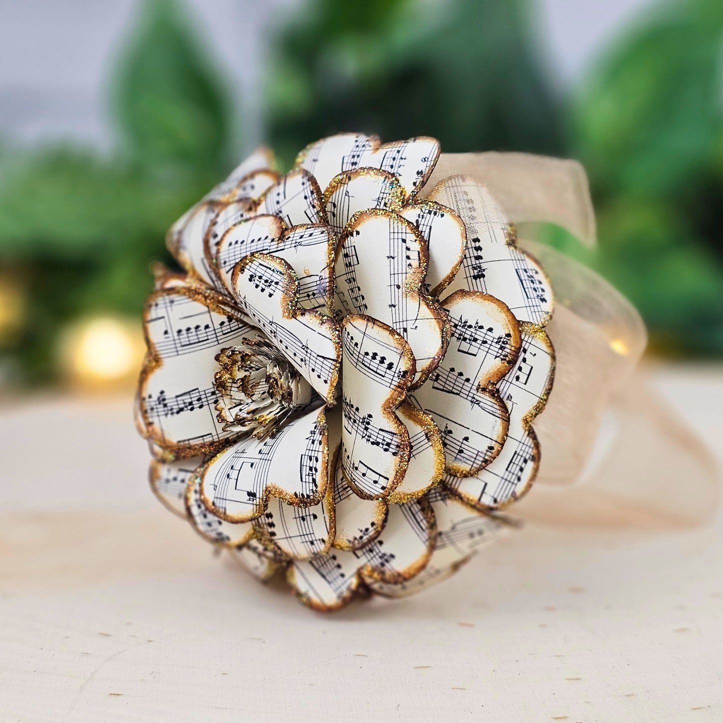 Close-up of vintage sheet music paper rose showing hand-stained petals
