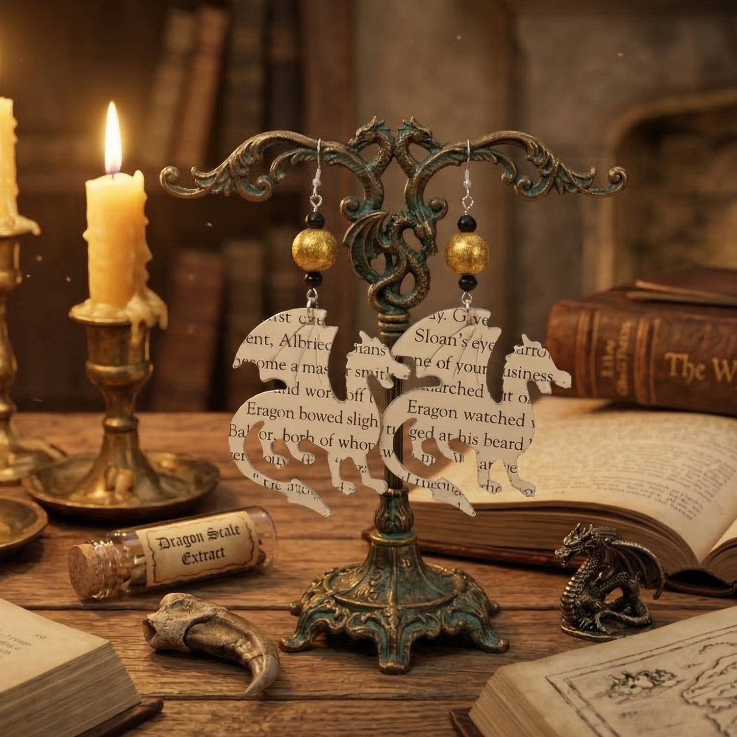 dragon earrings displayed on an earring tree, gift for book lovers