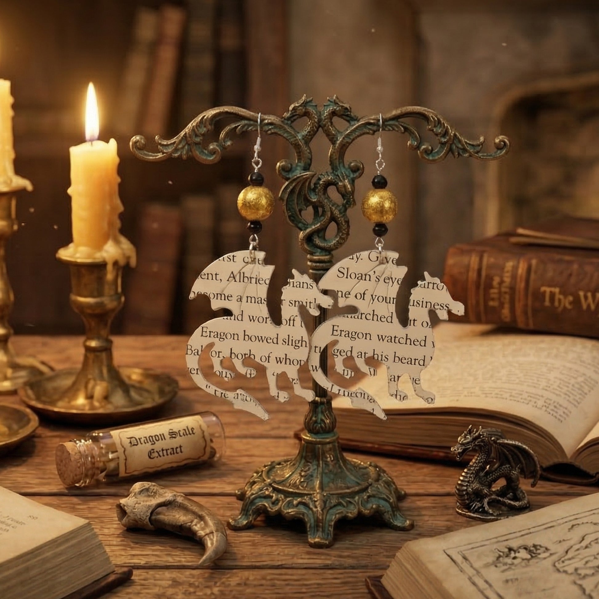 dragon earrings displayed on an earring tree, gift for book lovers