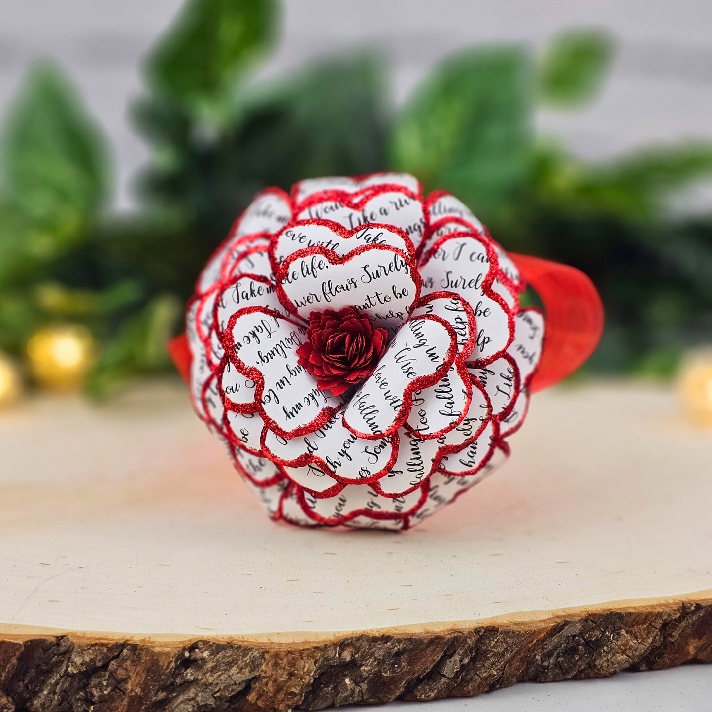 Front view of handmade song lyric rose - red paper flower with personalized text