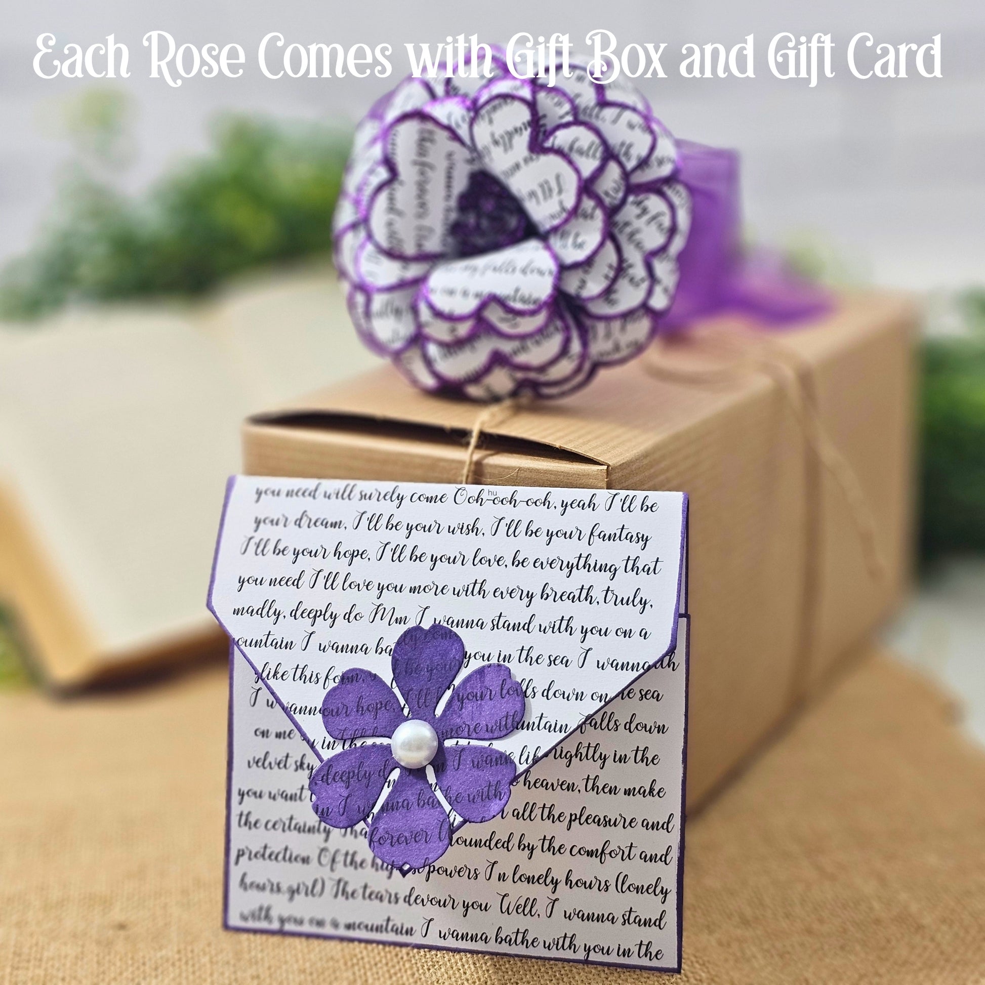Purple flower with a gift card and box on a blurred background