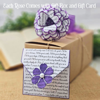 Purple flower with a gift card and box on a blurred background