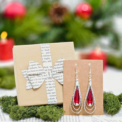 Handcrafted book lover earrings with red glass bead accent detail