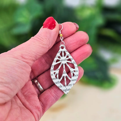 close up of book page earrings
