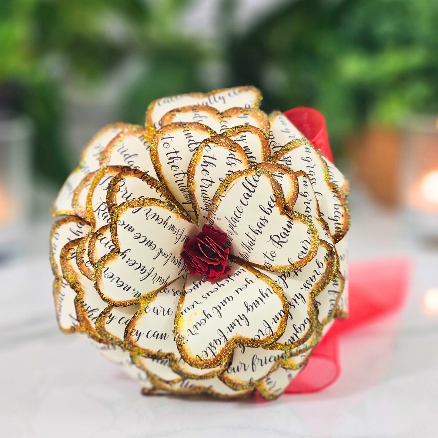 Close-up detail of handcrafted memorial rose made from upcycled book pages