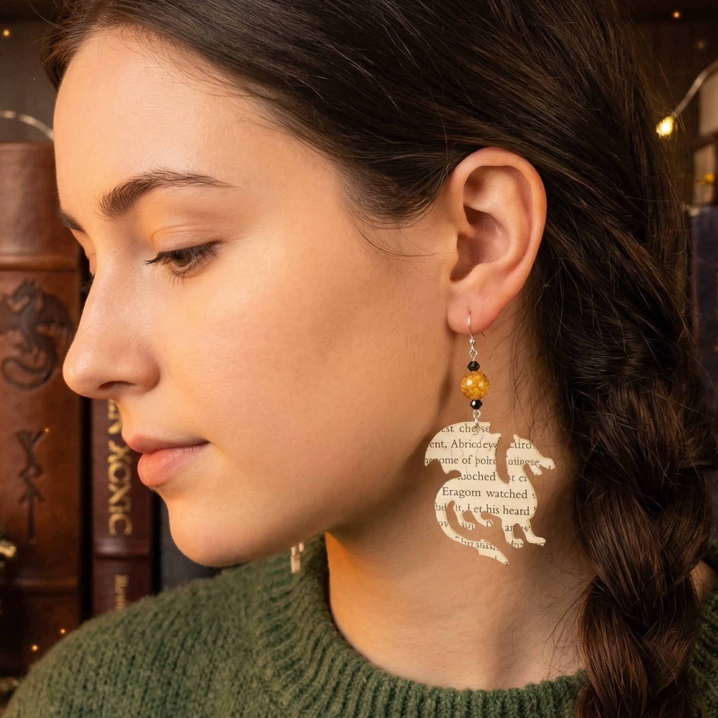 modeled shot of book page earrings