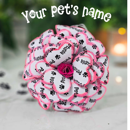 Personalized pet memorial rose with custom pet name on paw print ribbon