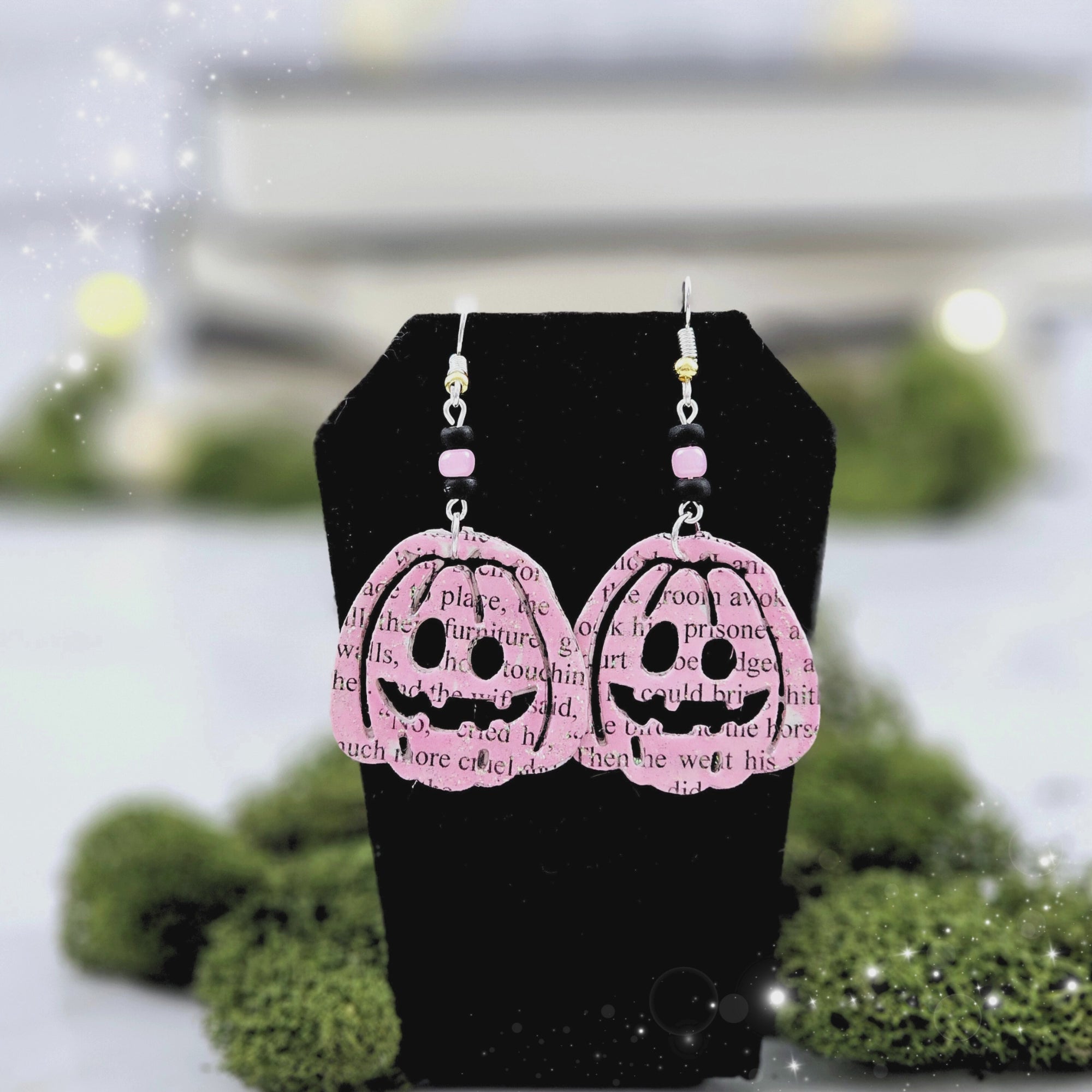 Pink Pumpking dangle earrings made with upcycled book pages.  Ear wire choices are sterling silver or silver plated.  Each pair comes with a book page envelope for gifting and care instructions.