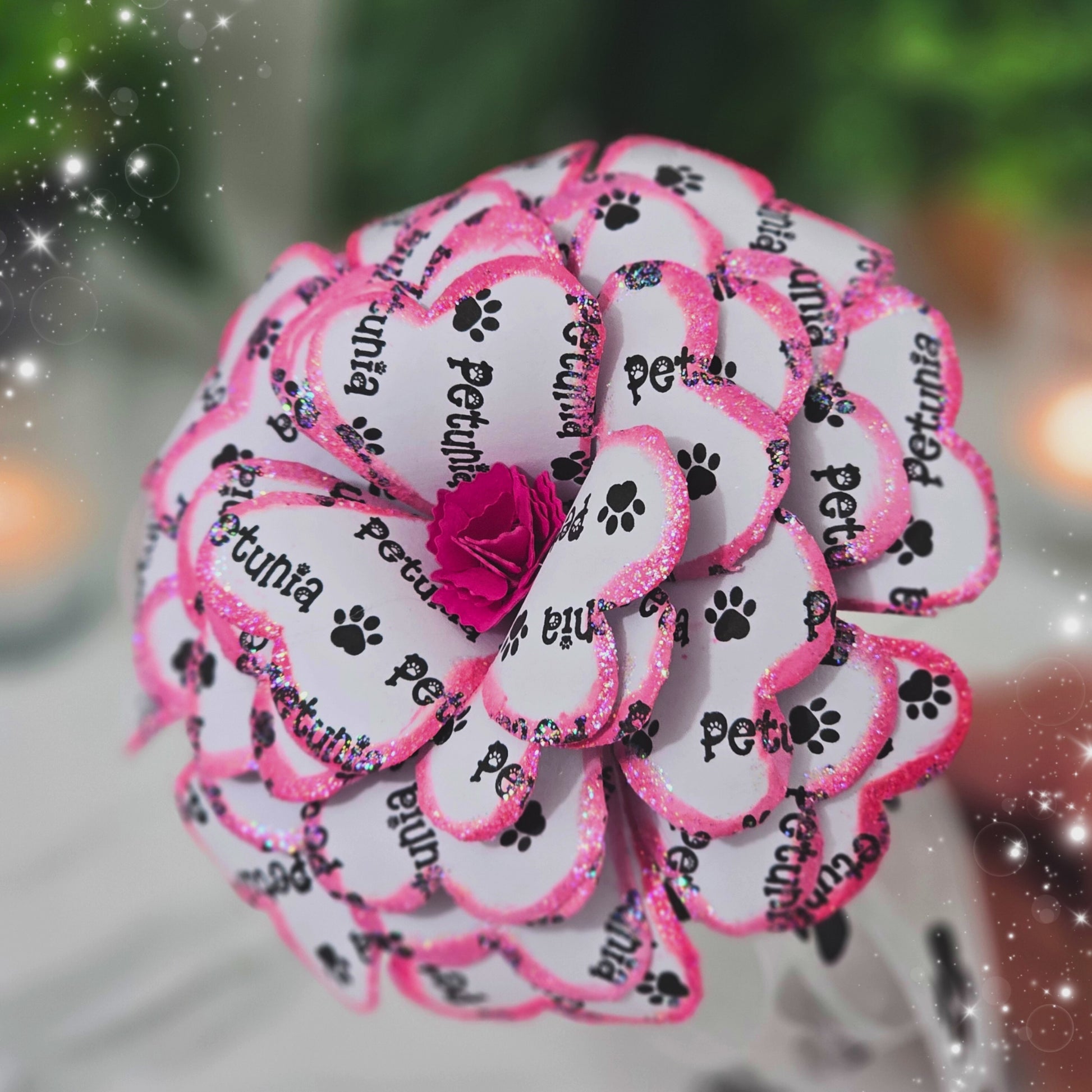 Close-up detail of handcrafted pink memorial rose made from upcycled book pages