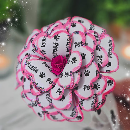 Close-up detail of handcrafted pink memorial rose made from upcycled book pages